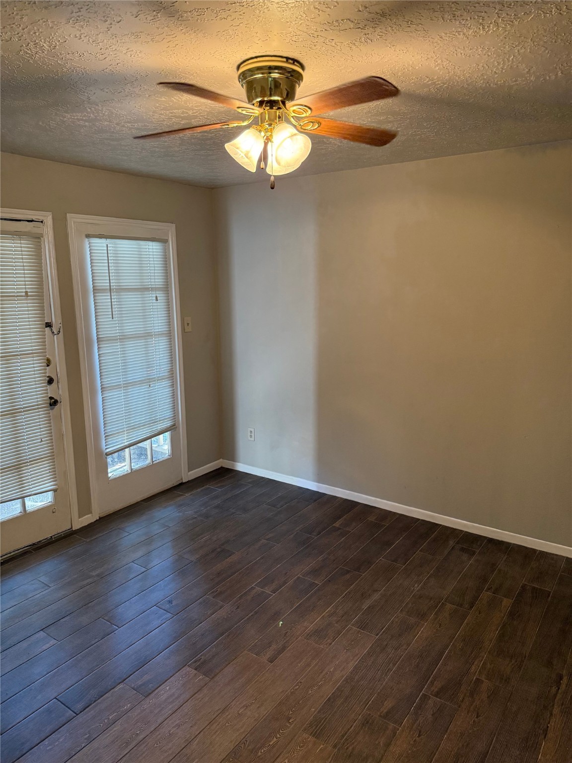 11500 Meadow Lane, Unit 4 Houston, TX 77477 - Photo 2 of 13 a view of an empty room with wooden floor and a window