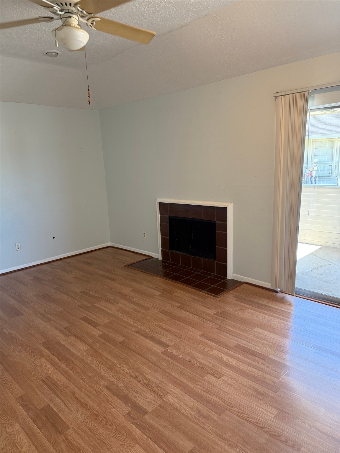 11500 Meadow Lane, Unit 4 Houston, TX 77477 - Photo 3 of 13 a view of an empty room with wooden floor and a window