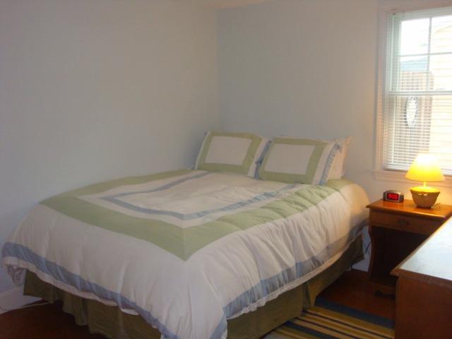 49 Lawrence Road Dennis Port, MA 02639 - Photo 12 of 14 a bedroom with a bed and window