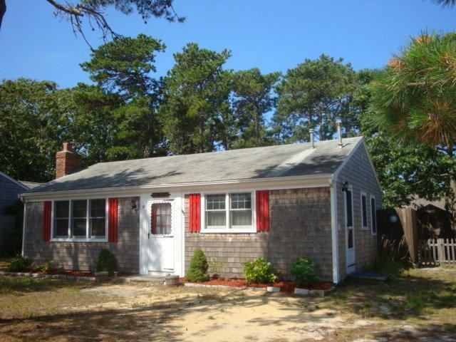 49 Lawrence Road Dennis Port, MA 02639 - Photo 2 of 14 a front view of a house with garden and porch