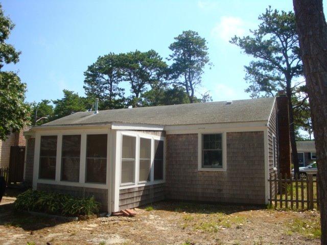 49 Lawrence Road Dennis Port, MA 02639 - Photo 3 of 14 a view of a house with a yard