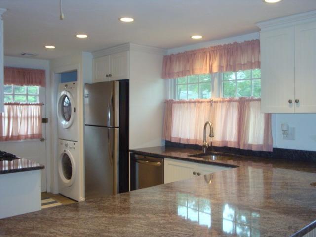 49 Lawrence Road Dennis Port, MA 02639 - Photo 4 of 14 a kitchen with stainless steel appliances granite countertop a refrigerator a sink and a stove
