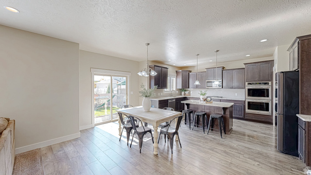 368 East 700 North Springville, UT 84663 - Photo 4 of 55 Dining space with recessed lighting, a textured ceiling, and light wood-style floors
