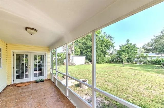 a front view of house with a garden