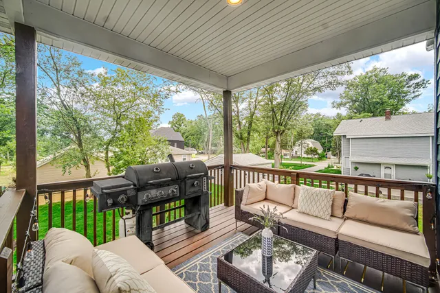 a balcony with furniture and garden view