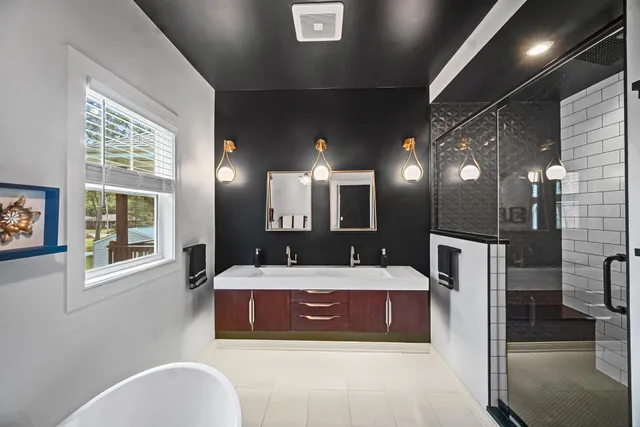 a large bedroom with a large bed and a large window