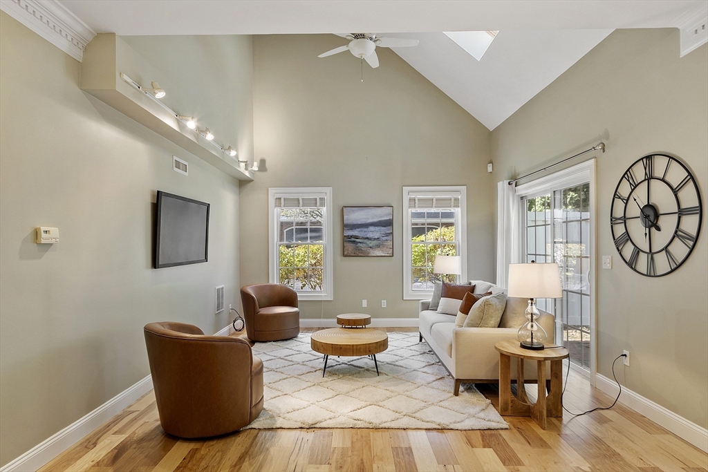 139 Prospect Street, Unit 5 Acton, MA 01720 - Photo 13 of 34 a living room with furniture and a large window
