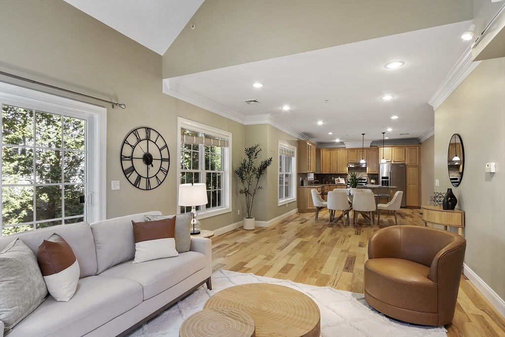 139 Prospect Street, Unit 5 Acton, MA 01720 - Photo 14 of 34 a living room with furniture and a large window