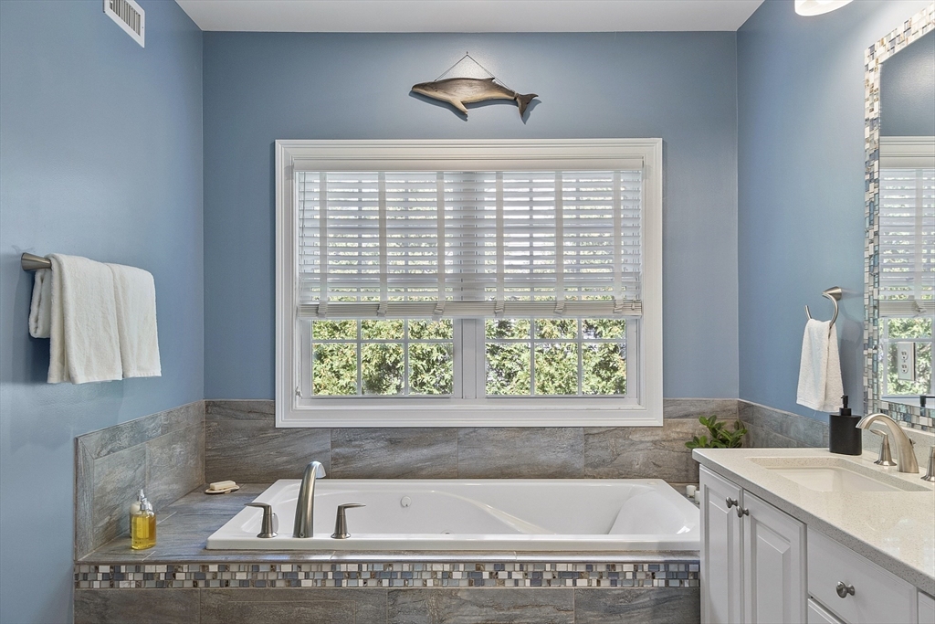 139 Prospect Street, Unit 5 Acton, MA 01720 - Photo 18 of 34 a bathroom with a bathtub and a sink