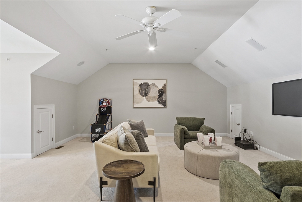 139 Prospect Street, Unit 5 Acton, MA 01720 - Photo 23 of 34 a living room with furniture and a chandelier