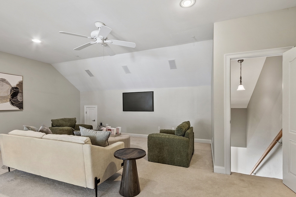 139 Prospect Street, Unit 5 Acton, MA 01720 - Photo 24 of 34 a living room with furniture and a flat screen tv