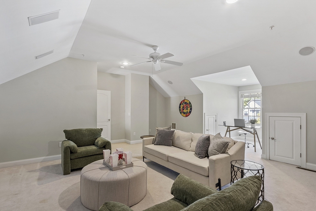 139 Prospect Street, Unit 5 Acton, MA 01720 - Photo 25 of 34 a living room with furniture and a mirror