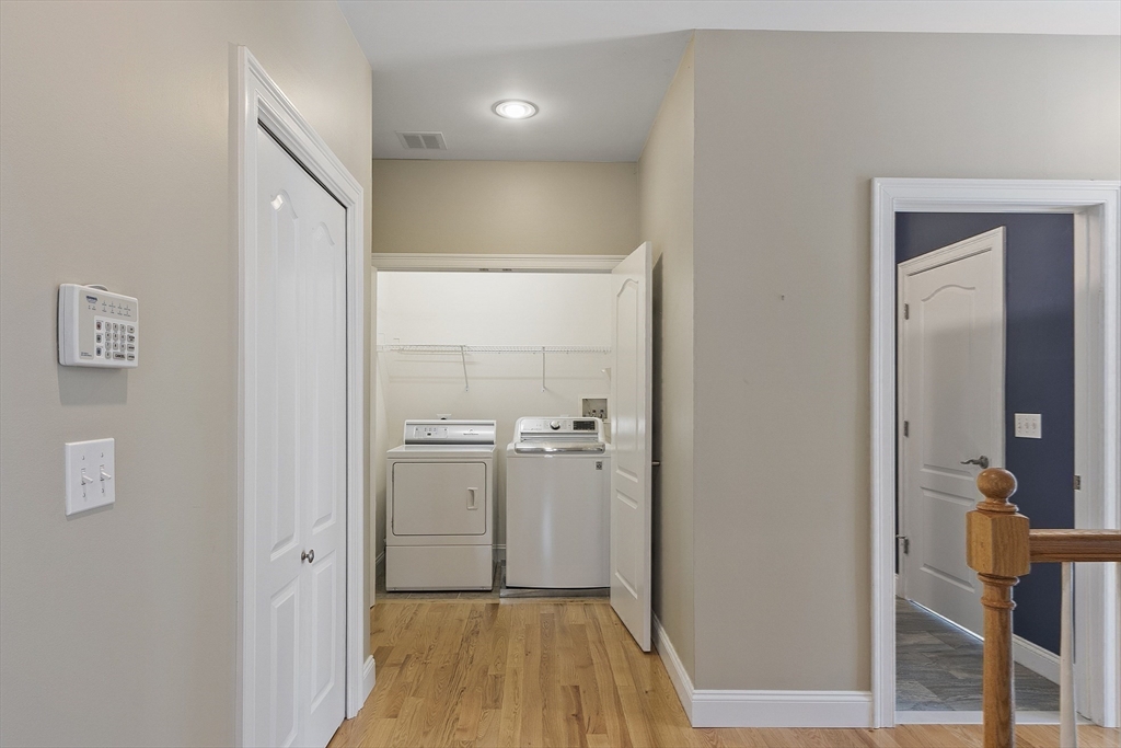 139 Prospect Street, Unit 5 Acton, MA 01720 - Photo 28 of 34 a view of a hallway with wooden floor