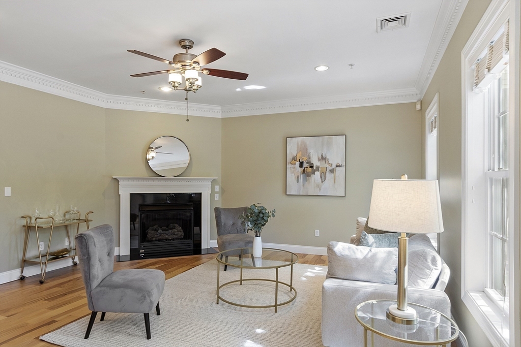 139 Prospect Street, Unit 5 Acton, MA 01720 - Photo 3 of 34 a living room with furniture and a fireplace