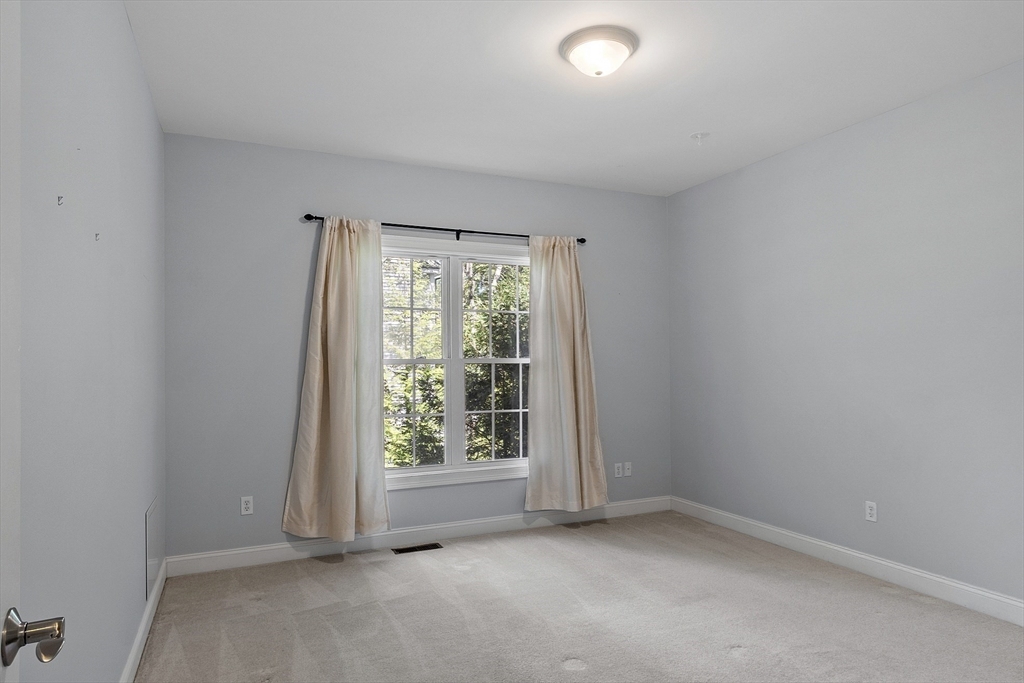 139 Prospect Street, Unit 5 Acton, MA 01720 - Photo 32 of 34 an empty room with a window
