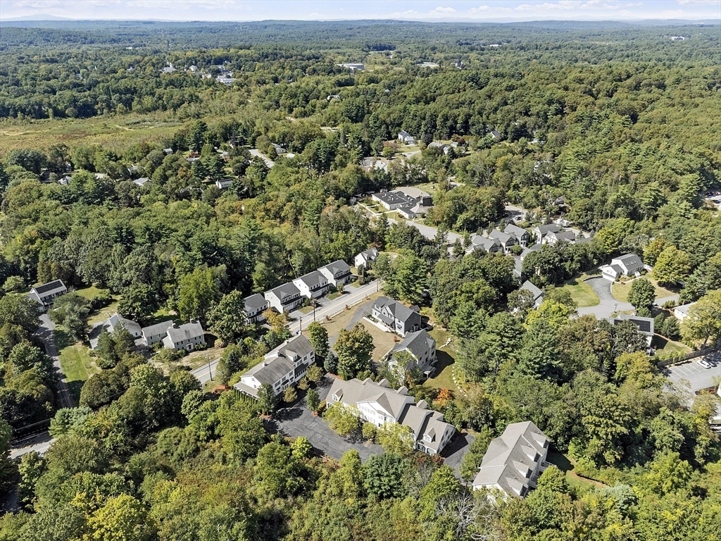 139 Prospect Street, Unit 5 Acton, MA 01720 - Photo 33 of 34 an aerial view of a houses with a yard