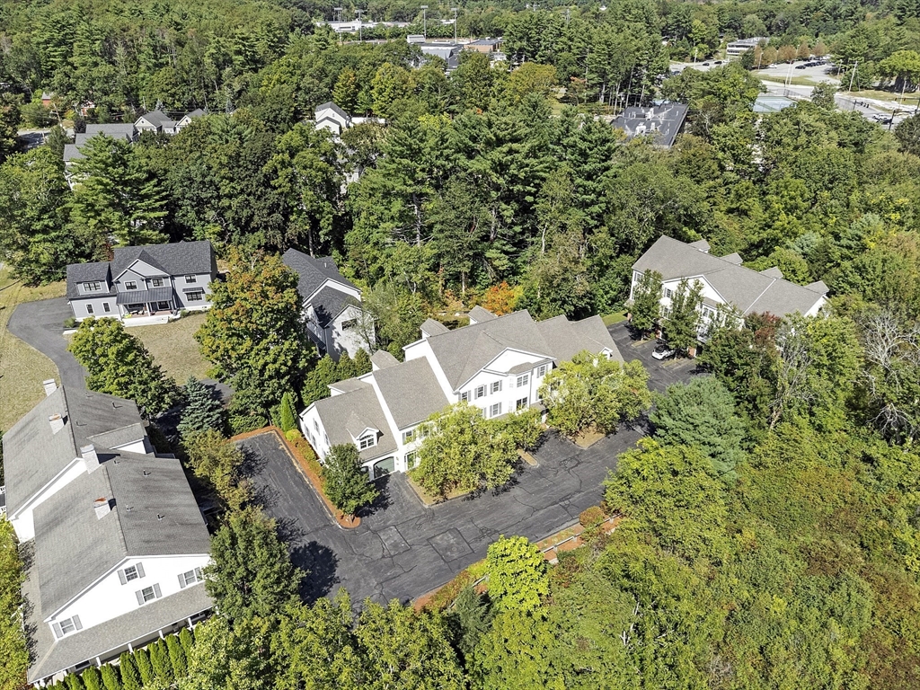 139 Prospect Street, Unit 5 Acton, MA 01720 - Photo 34 of 34 an aerial view of a house with a yard and trees