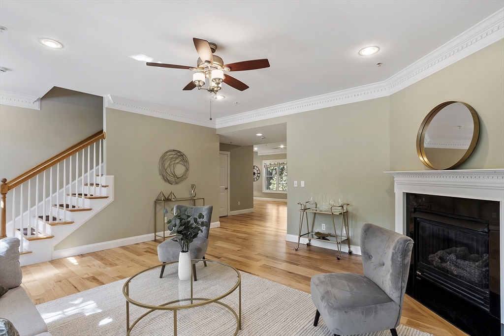 139 Prospect Street, Unit 5 Acton, MA 01720 - Photo 4 of 34 a living room with furniture a fireplace and a window