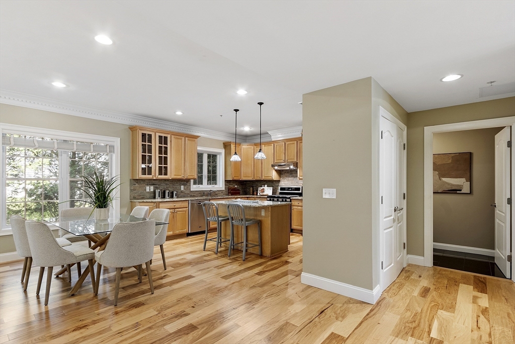 139 Prospect Street, Unit 5 Acton, MA 01720 - Photo 6 of 34 a kitchen with a table and chairs in it