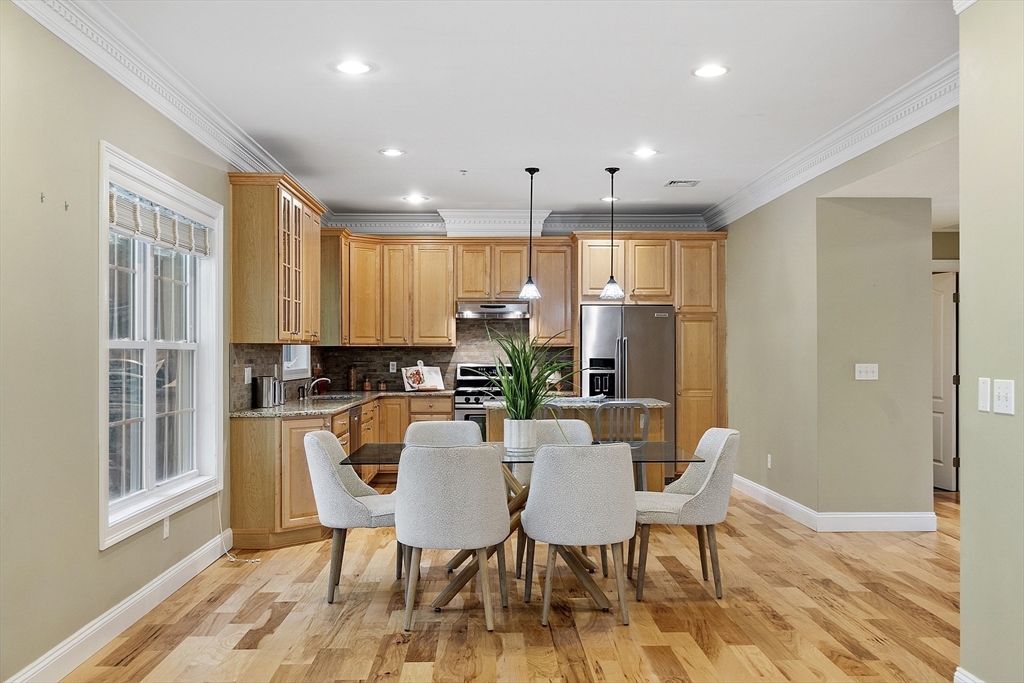 139 Prospect Street, Unit 5 Acton, MA 01720 - Photo 8 of 34 a view of a dining room with furniture window and wooden floor