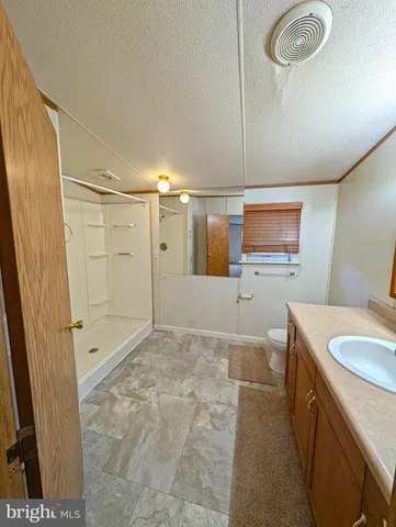 a view of an empty room and glass door