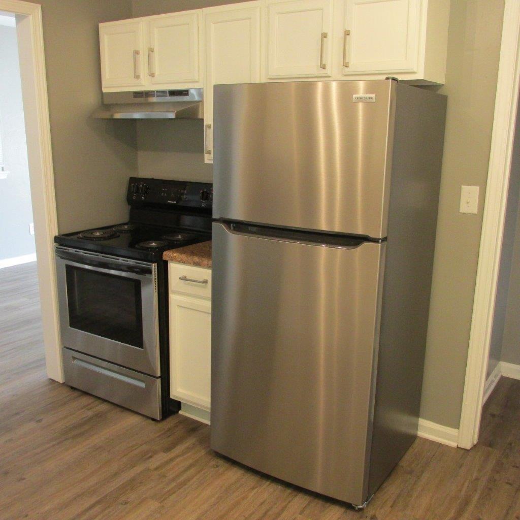 1525 Andrews Road Northwest Roanoke, VA 24017 - Photo 3 of 14 a white refrigerator freezer sitting inside of a kitchen