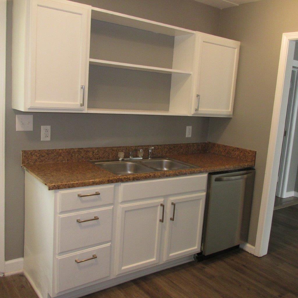 1525 Andrews Road Northwest Roanoke, VA 24017 - Photo 4 of 14 a kitchen with granite countertop white cabinets and a wooden floor