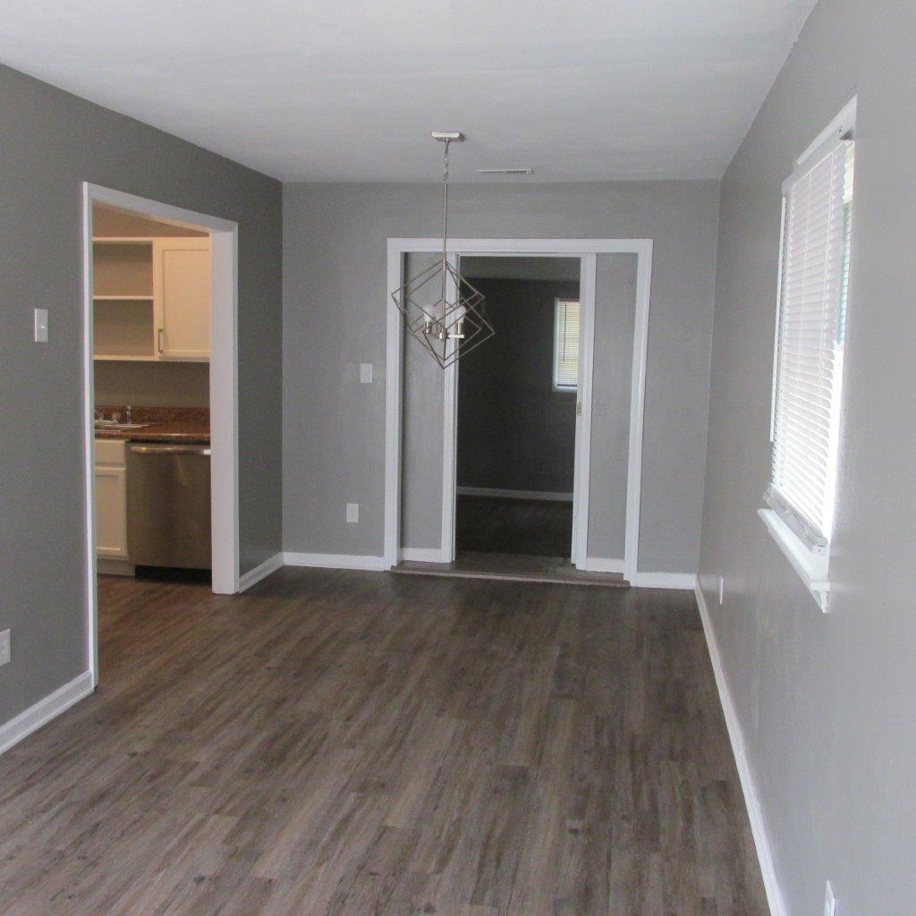 1525 Andrews Road Northwest Roanoke, VA 24017 - Photo 5 of 14 an empty room with wooden floor closet and windows