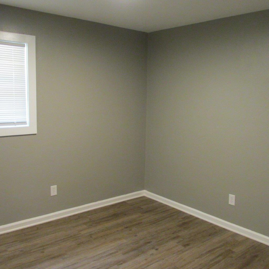 1525 Andrews Road Northwest Roanoke, VA 24017 - Photo 8 of 14 a view of an empty room with wooden floor and a window