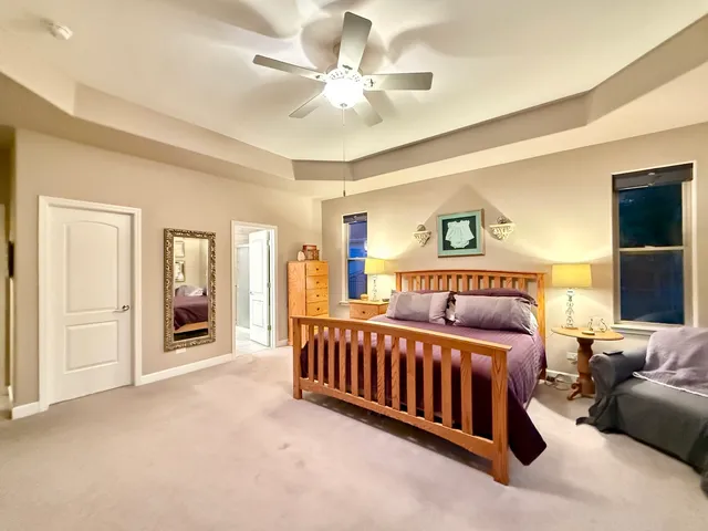 a bed room with a bed and a chandelier