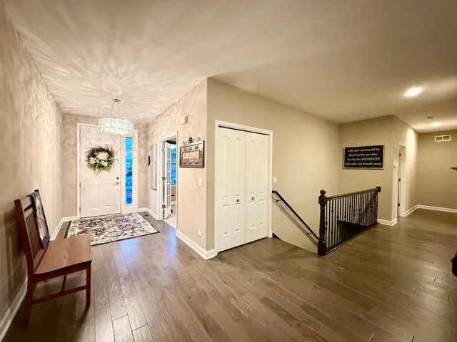 a view of a livingroom with furniture and wooden floor