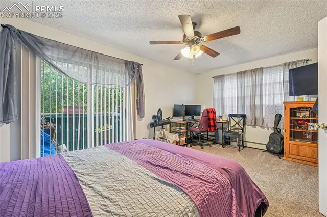 a bed room with a bed and a tv