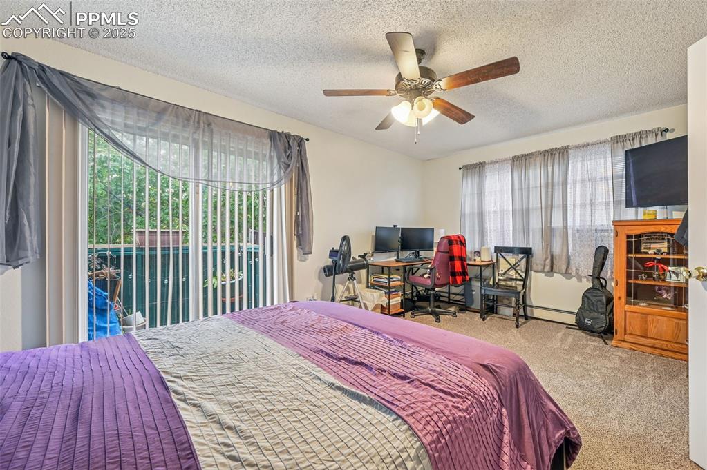 1131 Willow Bend Circle, Unit 2 Colorado Springs, CO 80918 - Photo 17 of 21 a bed room with a bed and a large window