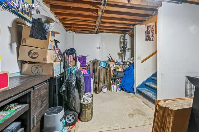 a bathroom with a granite countertop toilet sink and mirror