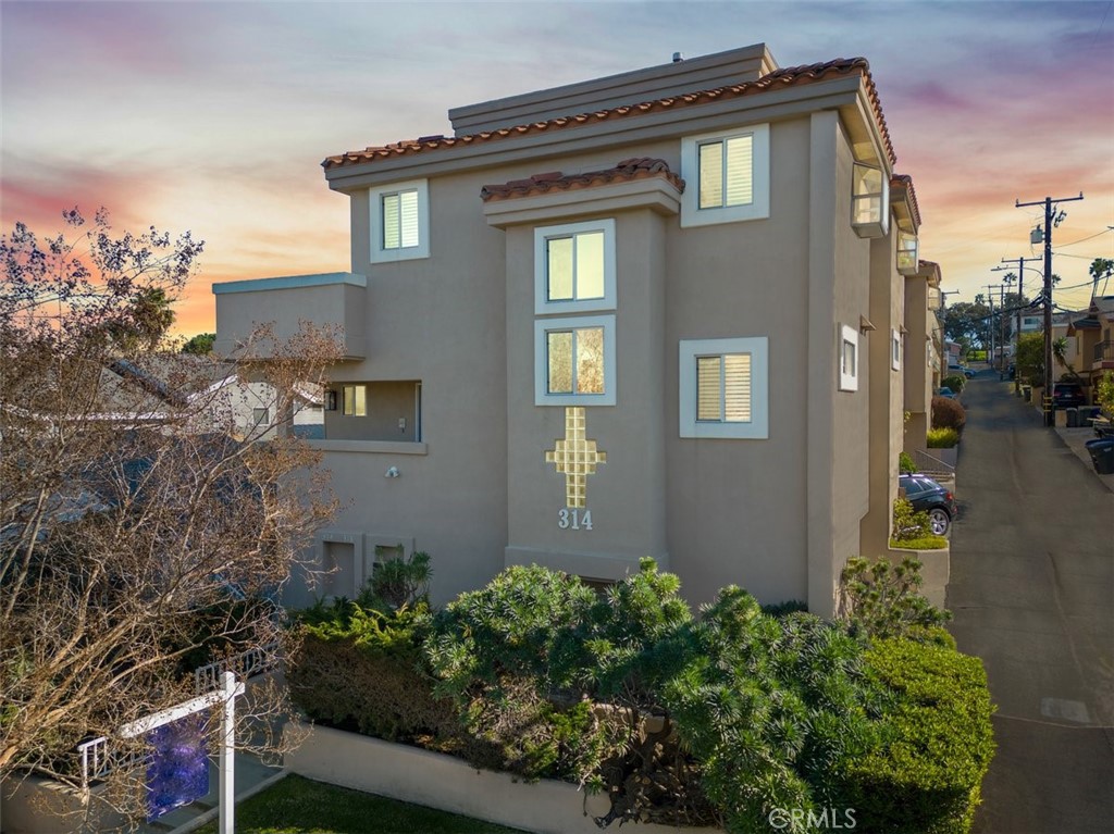 314 Penn Street, Unit 2 El Segundo, CA 90245 - Photo 1 of 23 a front view of a house with plants