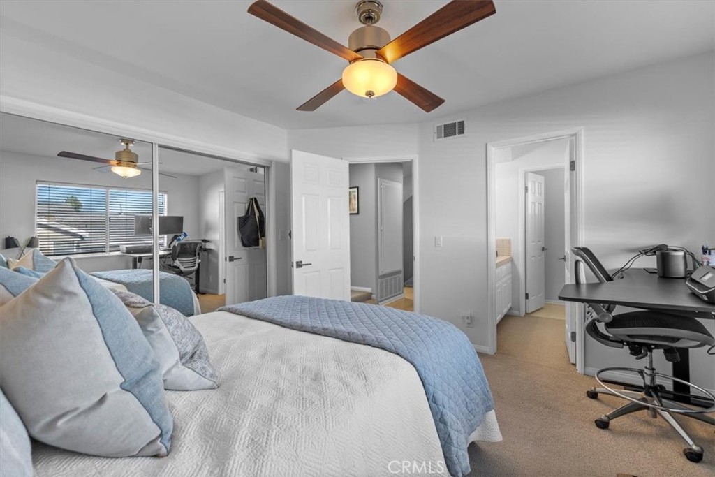 314 Penn Street, Unit 2 El Segundo, CA 90245 - Photo 15 of 23 a bedroom with a bed and a chandelier