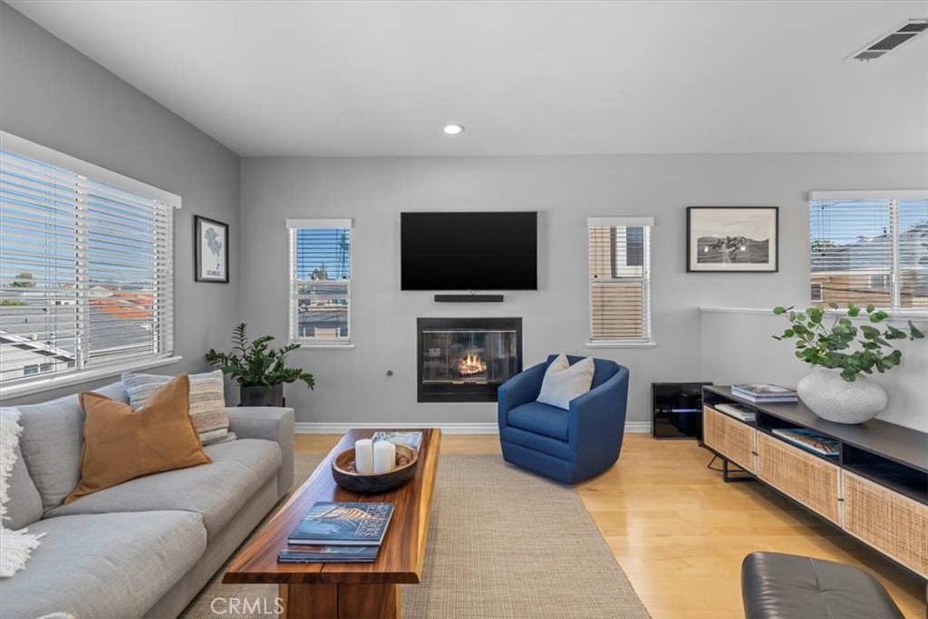 314 Penn Street, Unit 2 El Segundo, CA 90245 - Photo 2 of 23 a living room with furniture flat screen tv and a fireplace