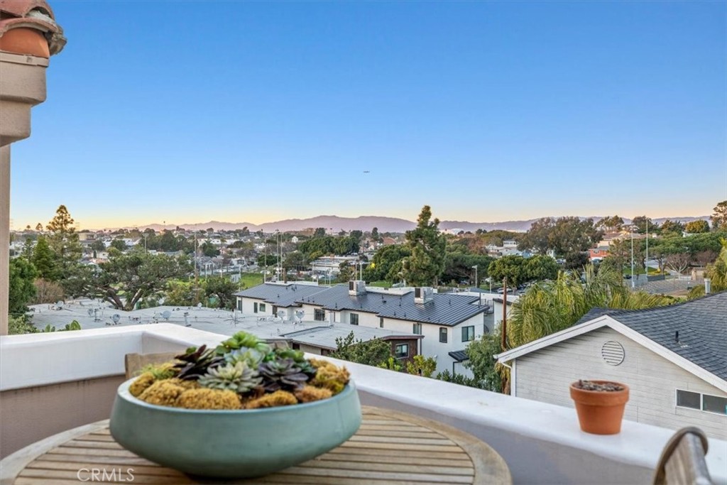 314 Penn Street, Unit 2 El Segundo, CA 90245 - Photo 6 of 23 a view of a roof deck with a table and chairs