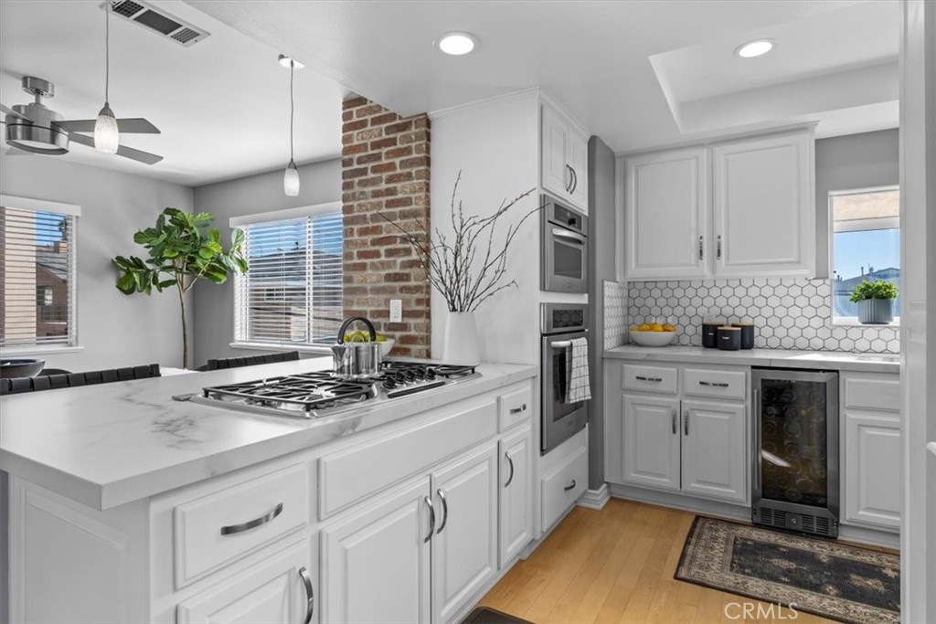 314 Penn Street, Unit 2 El Segundo, CA 90245 - Photo 9 of 23 a kitchen with stainless steel appliances granite countertop a stove a sink and a refrigerator