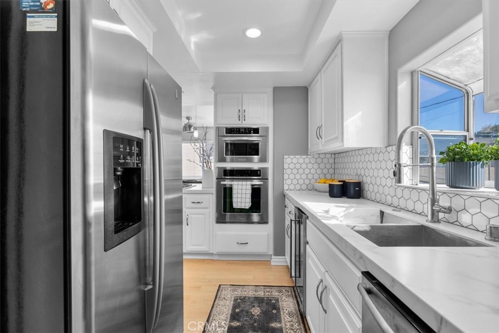 314 Penn Street, Unit 2 El Segundo, CA 90245 - Photo 10 of 23 a kitchen with stainless steel appliances granite countertop a refrigerator and a sink