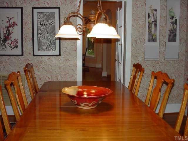 It is hard to capture the classic elegance of this formal dining room in a photo. It is traditional and yet very comtemporary at the same time. The hardwood flooring gives a warm feel to the room. The baseboards are crisp and bold. Dining Room