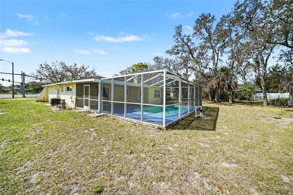 113 Ruskin Avenue Spring Hill, FL 34606 - Photo 27 of 32 a view of a house with backyard