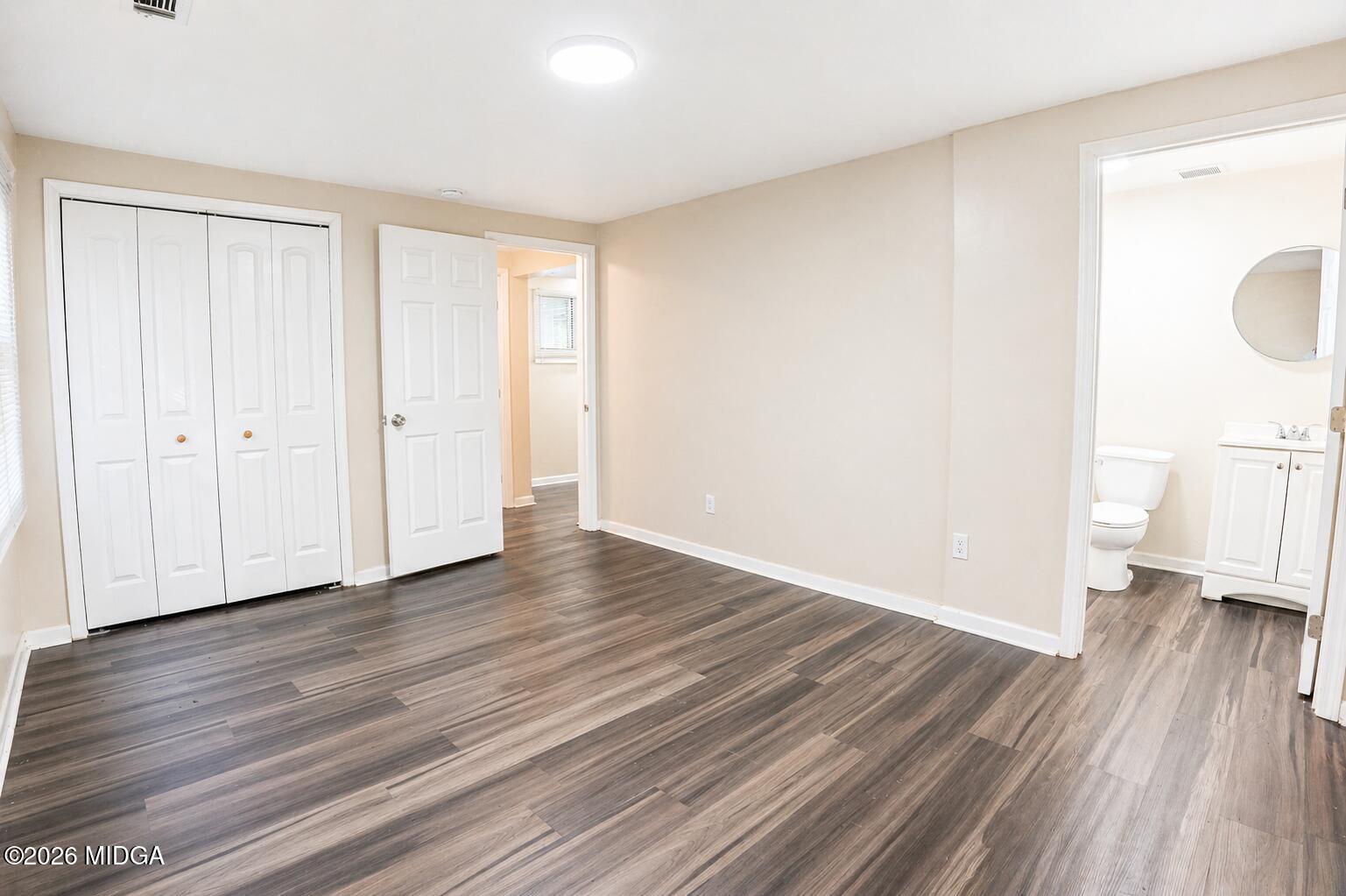 1957 Kitchens Road Macon, GA 31211 - Photo 13 of 18 a view of a room with wooden floor and natural light