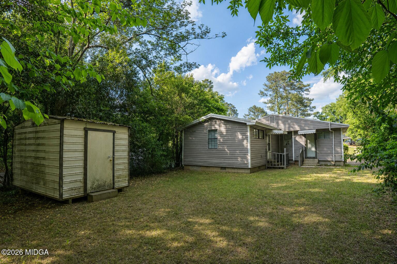 1957 Kitchens Road Macon, GA 31211 - Photo 17 of 18 a view of a house with a yard