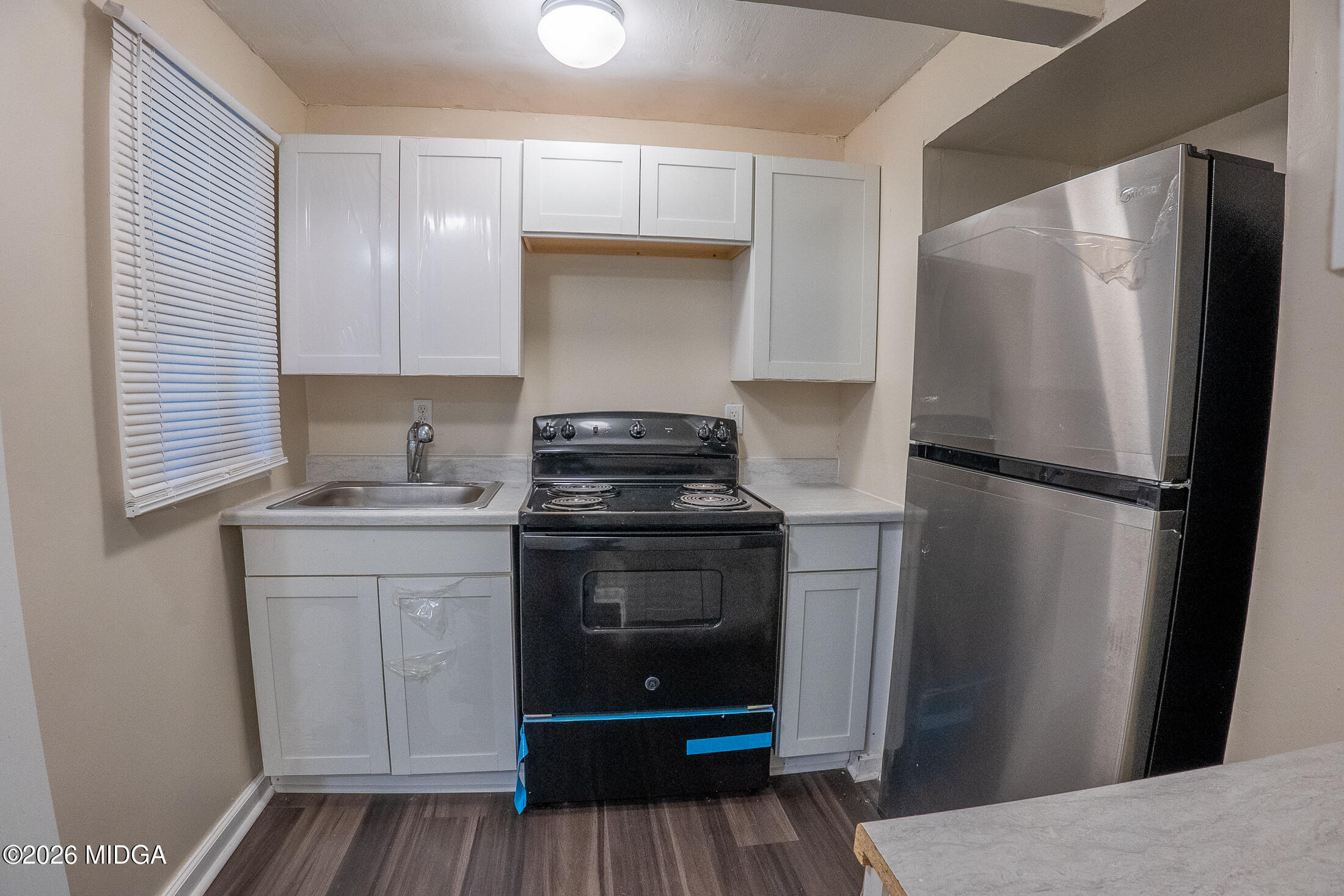 1957 Kitchens Road Macon, GA 31211 - Photo 7 of 18 a kitchen with a refrigerator and a stove