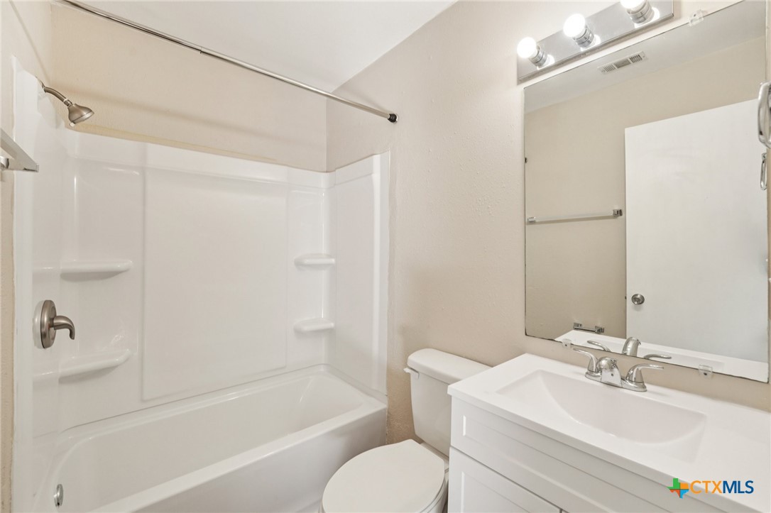 1634 Post Road, Unit 4 San Marcos, TX 78666 - Photo 11 of 11 a bathroom with a sink toilet and shower