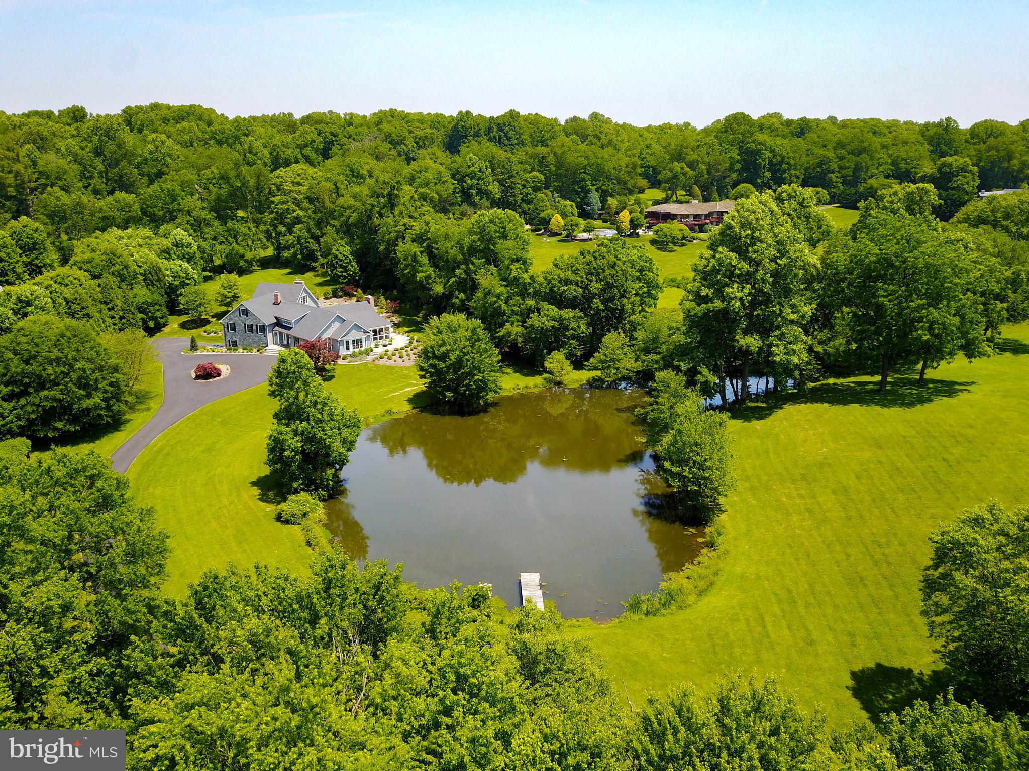 Spectacular 3 acre lot w/50% ownership of pond.