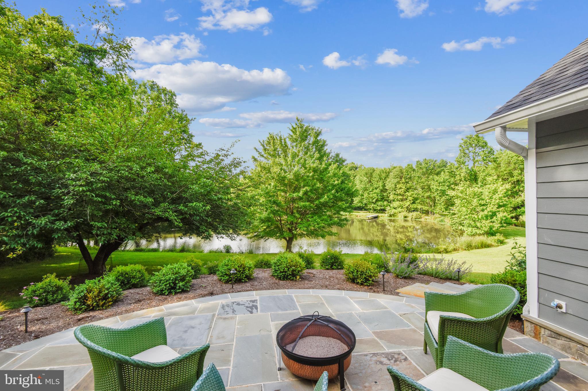 535 Springvale Road Great Falls, VA 22066 - Photo 27 of 80 New stone patio outside of the screened in porch
