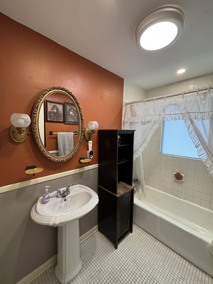 44 Norman Street Kankakee, IL 60901 - Photo 4 of 14 a bathroom with a sink toilet and a mirror