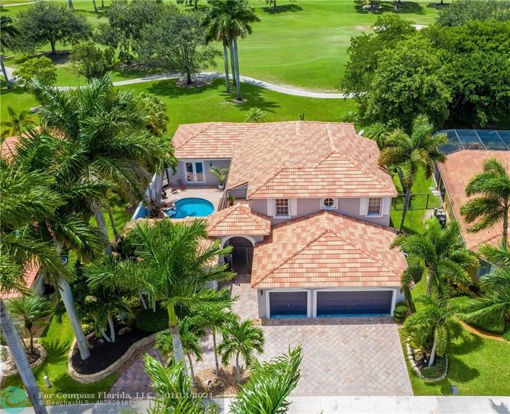 Spectacular one-of-kind 4BD+LIBRARY/4BA/3CG COURTYARD home with stunning GOLF views of the 6th Fairway of the Players Course in Weston Hills! Wrought-iron gated entry into a private entertainers paradise.